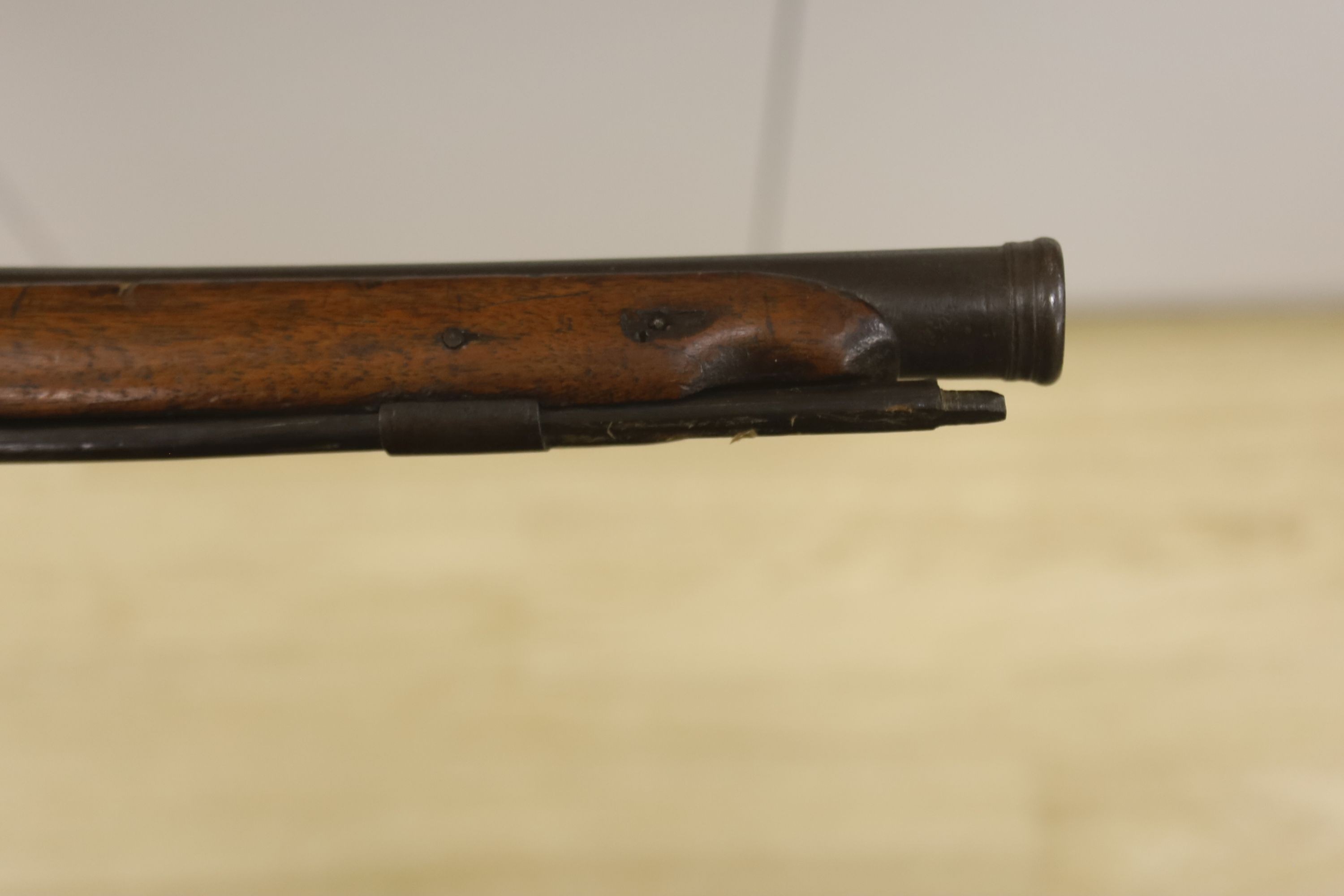 An early 19th century Belgian percussion cap carbine with carved walnut stock and silver inlaid barrel, bears indistinct mark, barrel 38cm, overall length 78cm